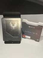 Halo 5 Guardians Limited Edition SteelBook front showing embossed UNSC phoenix crest alongside original Limited Edition inner box back panel
