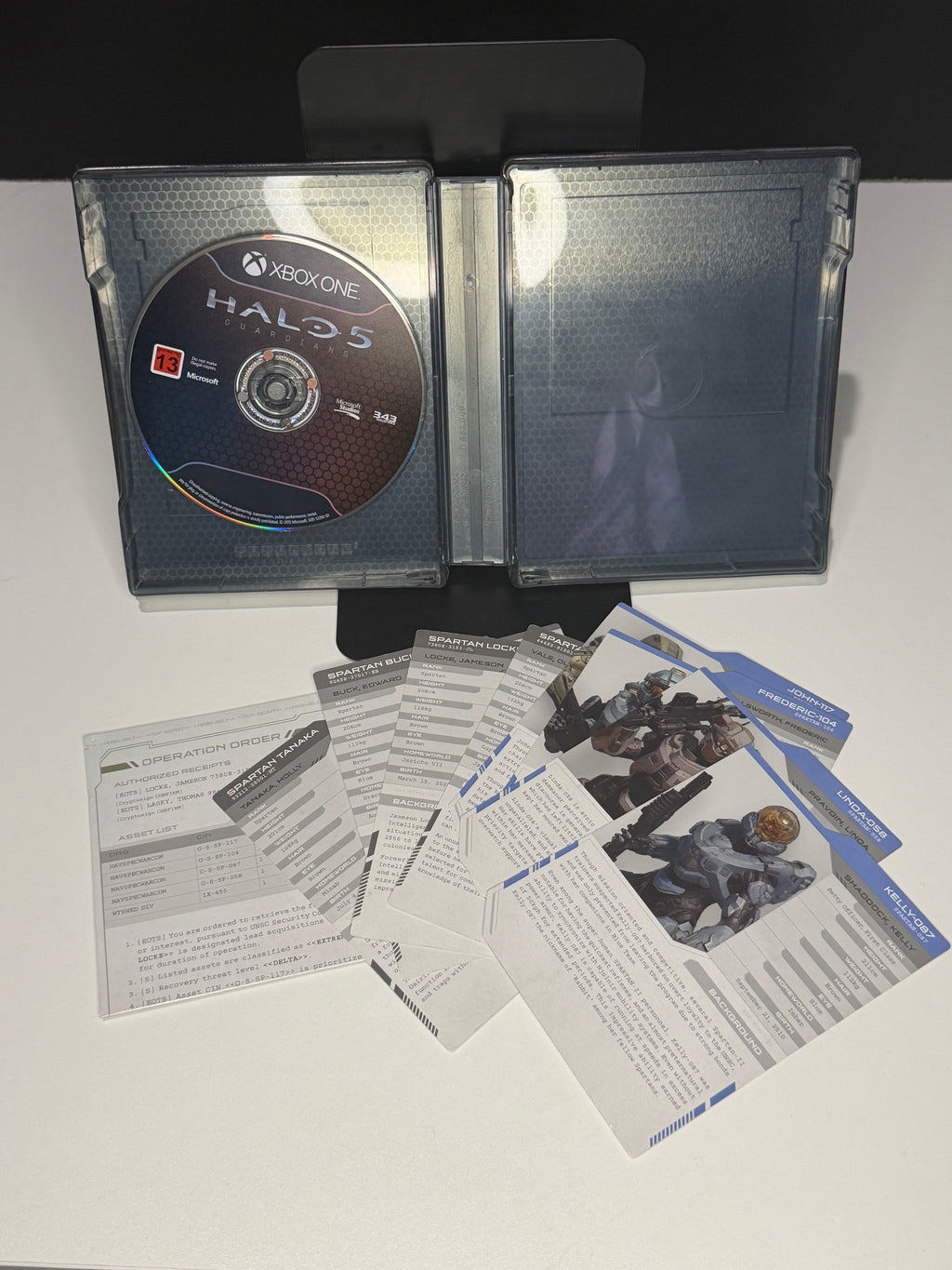 Halo 5 Guardians Limited Edition SteelBook back and Limited Edition inner box back panel showing Hunt the Truth tagline and bundle contents list