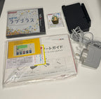 Nintendo 3DS NEW LovePlus+ NEW Rinko Deluxe full contents laid out showing console, factory-sealed game, Japanese paperwork, guides, inserts, accessories and NZ-compatible charger