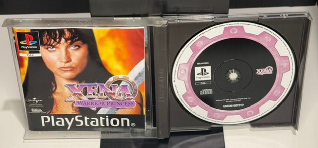 Xena Warrior Princess PS1 open jewel case showing pink Xena branded disc and original cover insert with Lucy Lawless artwork