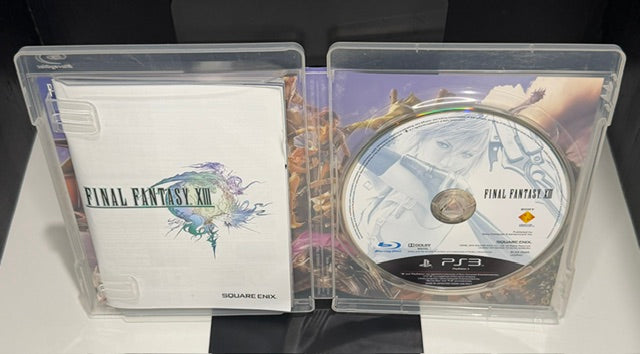 Final Fantasy XIII PS3 Asian version open case showing Final Fantasy XIII disc and white Square Enix manual
