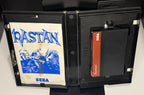 Rastan Sega Master System open case showing manual with yellowing and foxing stain and SMS cartridge with red Sega label
