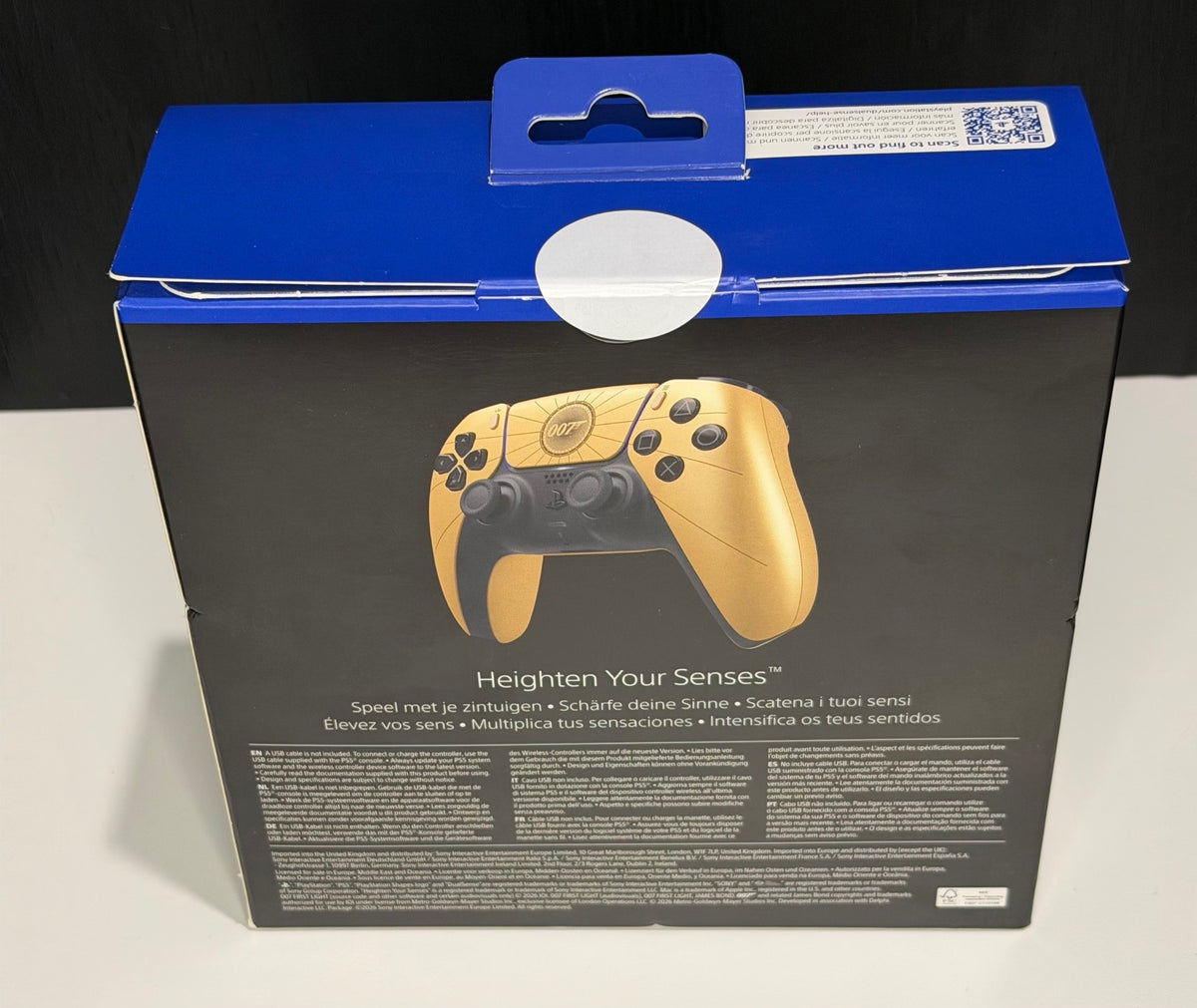 DualSense Limited Edition 007 First Light PS5 controller box back showing Heighten Your Senses tagline with gold controller detail