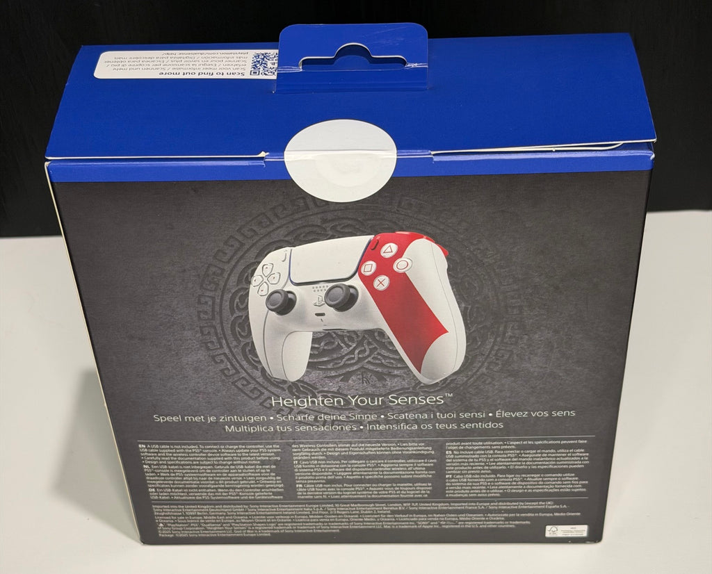 DualSense Limited Edition God of War 20th Anniversary PS5 controller box back showing Heighten Your Senses tagline with white and red controller on Norse knotwork background
