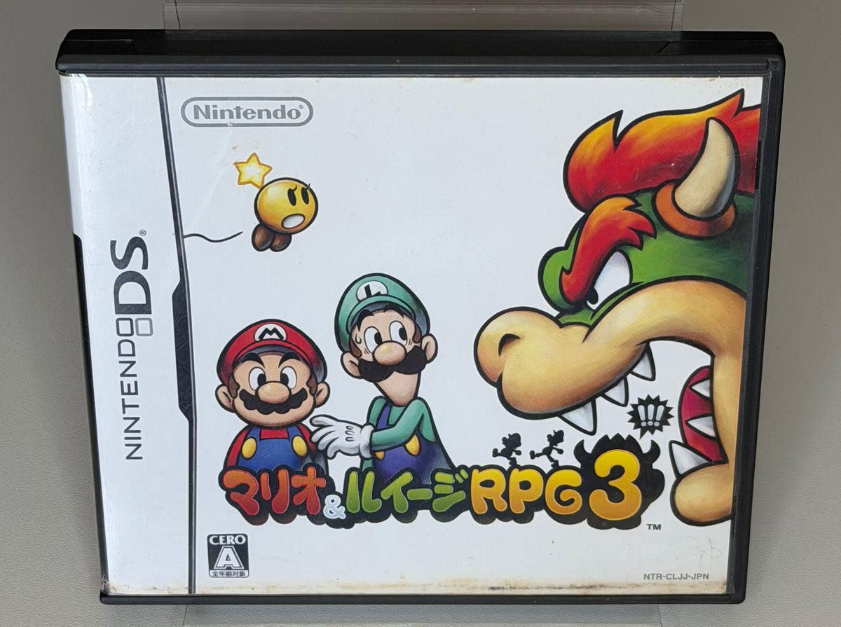 Mario and Luigi Bowsers Inside Story Nintendo DS Japanese back cover showing gameplay screenshots brother action RPG description and Japan only notice