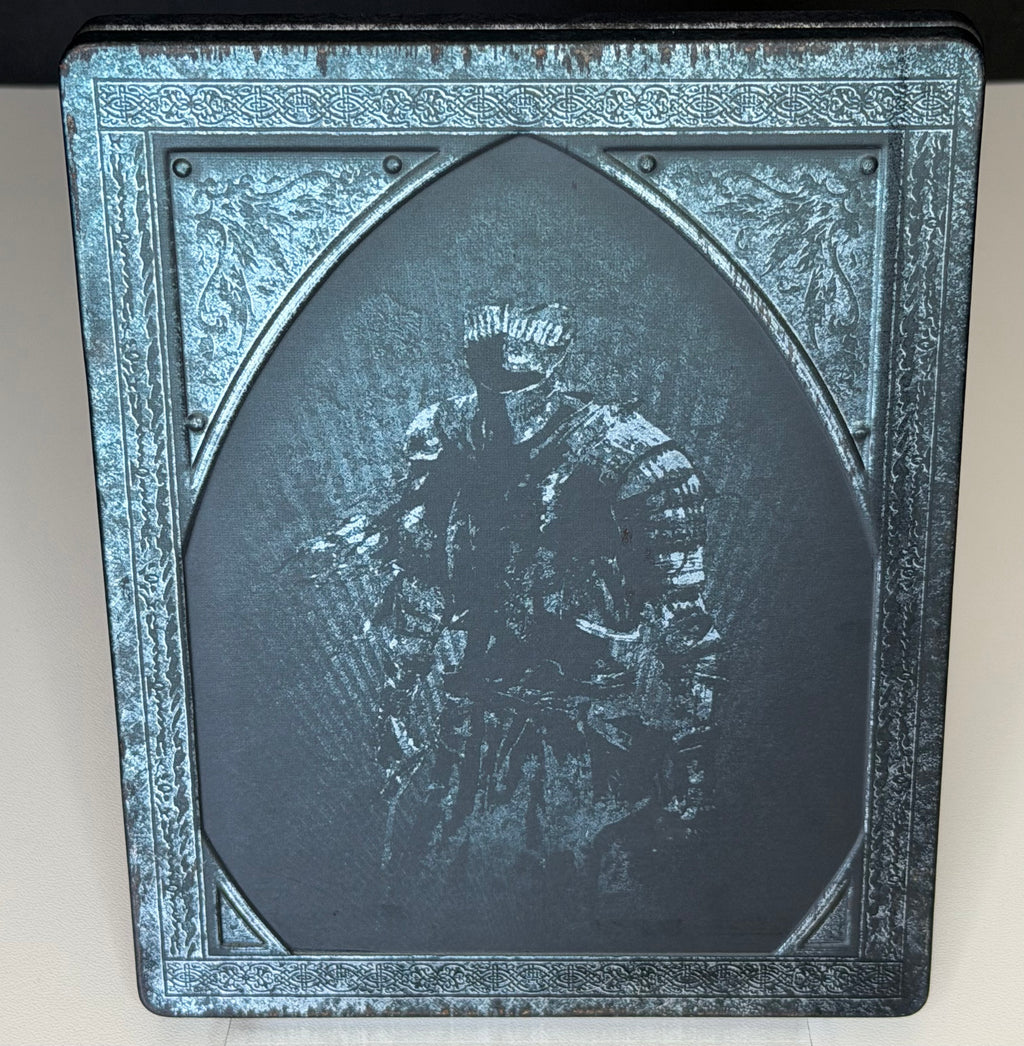 Dark Souls III SteelBook Edition PS4 back showing embossed seated armoured knight in relief on metal case
