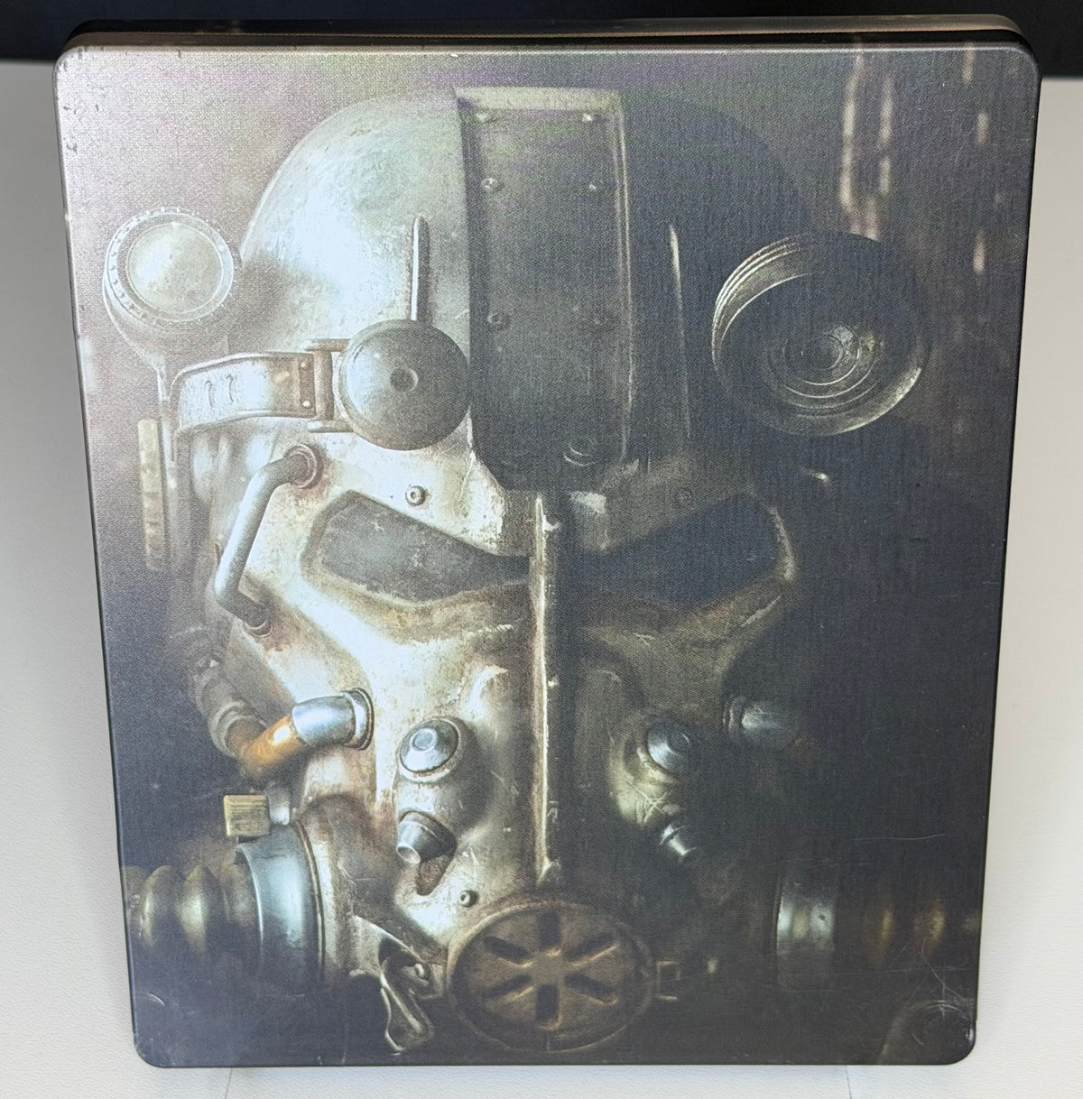 Fallout 4 SteelBook Edition PS4 back showing close-up T-60 Power Armor helmet on full-art printed metal case
