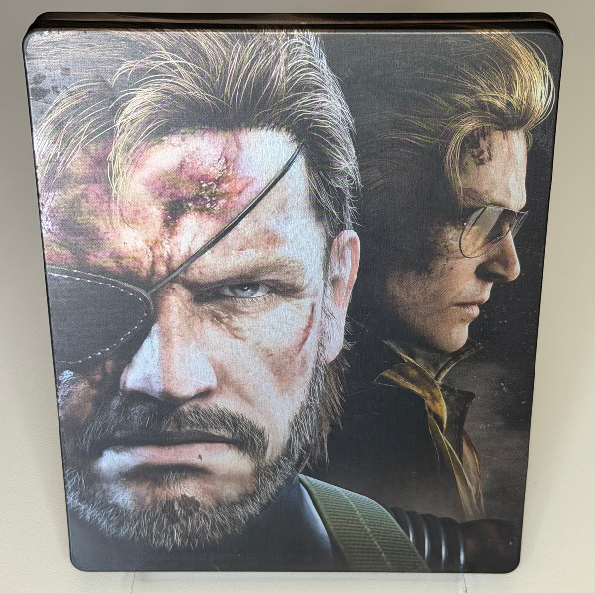 Metal Gear Solid V Phantom Pain Day One SteelBook PS4 front showing Venom Snake scarred face with Miller on full-art printed metal case
