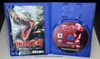 Turok Evolution PS2 open case showing AML 23273.01 ENG manual with T-Rex artwork on left panel and PAL DVD-ROM Acclaim game disc in right tray