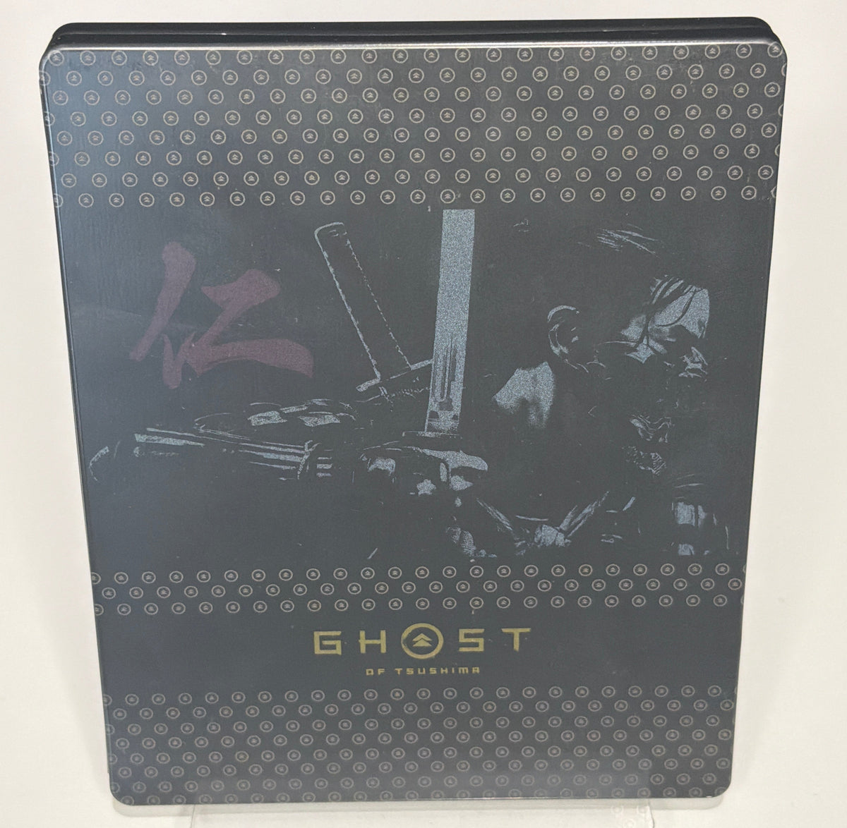 Ghost of Tsushima Special Edition SteelBook open showing disc and digital voucher card